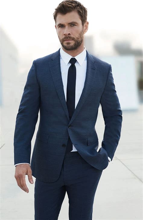 navy suit with black tie.